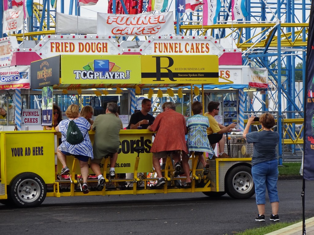 The Yellow Fellow takes riders for a peddle-powered ride up Broadway and back, serving snacks and samples along the way. Trips, which start near the kiddie midway are five bucks per adult.