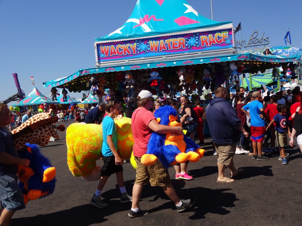 A couple of big winners had tote their overstuffed prizes off the midway. 
