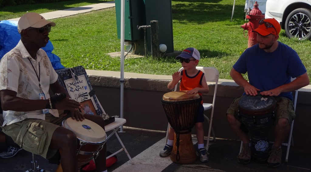 Visitors can pick up the beat at the Pan African Village by joining a drum circle. 
